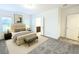 Spacious primary bedroom features a neutral color palette, soft carpet, and ensuite access at 14154 Shocklach Dr, Winter Garden, FL 34787