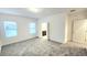 Bright, spacious bedroom featuring two windows providing ample natural light and neutral walls and carpet at 14154 Shocklach Dr, Winter Garden, FL 34787