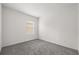An empty carpeted bedroom featuring a window with blinds and neutral-colored walls, perfect for customization at 14154 Shocklach Dr, Winter Garden, FL 34787