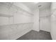 Walk-in closet with adjustable shelving, carpeted floor, and white walls at 14154 Shocklach Dr, Winter Garden, FL 34787