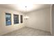 Bright dining area featuring tile flooring, a decorative chandelier, and multiple windows at 14154 Shocklach Dr, Winter Garden, FL 34787