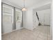 Bright dining room features tile flooring, a pendant light fixture and large windows at 14154 Shocklach Dr, Winter Garden, FL 34787