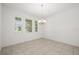 Dining room with tile floors, neutral paint, and three windows with wooden blinds at 14154 Shocklach Dr, Winter Garden, FL 34787