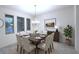 Bright dining room features a chandelier, table with seating for eight and neutral colors at 14154 Shocklach Dr, Winter Garden, FL 34787