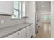 Well-lit kitchen featuring stainless steel appliances, granite countertops, and a subway tile backsplash at 14154 Shocklach Dr, Winter Garden, FL 34787