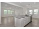 Open-concept kitchen with center island features stainless steel appliances and seamlessly connects to living area at 14154 Shocklach Dr, Winter Garden, FL 34787