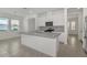 Bright kitchen featuring stainless appliances, granite countertops, and a large island with a breakfast bar at 14154 Shocklach Dr, Winter Garden, FL 34787