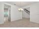 Open-concept living room features a chandelier, tile floors, and staircase at 14154 Shocklach Dr, Winter Garden, FL 34787