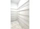 Walk-in pantry with wire shelving offers ample storage space for all your culinary needs at 14154 Shocklach Dr, Winter Garden, FL 34787