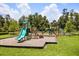 Well-maintained playground featuring slides, climbing structures, and a safe, cushioned ground surface for  at 14154 Shocklach Dr, Winter Garden, FL 34787