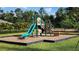 Community playground featuring a slide, steps, climbing area, and swing at 14154 Shocklach Dr, Winter Garden, FL 34787