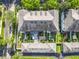 Aerial view of meticulously designed community with manicured lawns, townhomes, and patios at 2240 Osprey Ave, Orlando, FL 32814