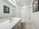 Bright bathroom featuring a vanity with a white sink, toilet, and shower at 2240 Osprey Ave, Orlando, FL 32814