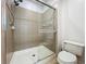 Bathroom shower featuring tile surround and glass door at 2240 Osprey Ave, Orlando, FL 32814