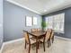 Well-lit dining room features neutral paint, tile floors, base molding, crown molding, and lots of natural light at 2240 Osprey Ave, Orlando, FL 32814