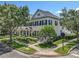 Charming two-story home with manicured landscaping, lush trees, and classic architectural details at 2240 Osprey Ave, Orlando, FL 32814