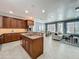 Spacious kitchen with stainless steel appliances and adjacent living and dining areas at 2240 Osprey Ave, Orlando, FL 32814
