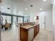 Open kitchen with granite countertops and breakfast bar, flowing into dining and living areas at 2240 Osprey Ave, Orlando, FL 32814