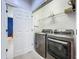 Laundry room with modern washer and dryer and shelving at 2240 Osprey Ave, Orlando, FL 32814