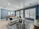 Open concept living room and dining area features tile floors, recessed lighting, and lots of natural light at 2240 Osprey Ave, Orlando, FL 32814