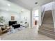 Open-concept living room with tile flooring, and staircase at 2240 Osprey Ave, Orlando, FL 32814