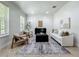 Bright living room with neutral tones, large windows, and minimalist decor at 2240 Osprey Ave, Orlando, FL 32814