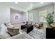 Bright and airy living room with tile floors, showcasing contemporary furniture at 2240 Osprey Ave, Orlando, FL 32814