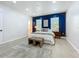 Bright main bedroom, featuring a bold accent wall, bed and modern decor at 2240 Osprey Ave, Orlando, FL 32814