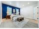 Spacious main bedroom with a bold accent wall, a bed, and modern decor at 2240 Osprey Ave, Orlando, FL 32814