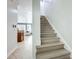 Staircase with wood steps and white risers at 2240 Osprey Ave, Orlando, FL 32814