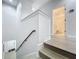Staircase with wood steps and a view of the upstairs hallway and bathroom at 2240 Osprey Ave, Orlando, FL 32814