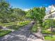 Street view showcasing mature trees lining the street of this community and manicured lawns at 2240 Osprey Ave, Orlando, FL 32814