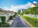 Quiet street featuring well-maintained townhomes with manicured landscaping and tree-lined sidewalks at 2240 Osprey Ave, Orlando, FL 32814