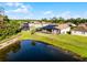 Aerial view showing the property, with screened-in pool, and nearby pond views, in a neighborhood setting at 2569 Gabrielle Woods Pl, Oviedo, FL 32765