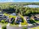Aerial view featuring the property near a pond and lush greenery, highlighting its serene location at 2569 Gabrielle Woods Pl, Oviedo, FL 32765