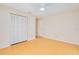Empty bedroom offers a large closet, neutral walls, and wood-look tile flooring at 2921 Sabal Palm Dr, Edgewater, FL 32141