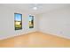 Large bedroom with tile floors, bright windows, and neutral walls for personalization at 2921 Sabal Palm Dr, Edgewater, FL 32141