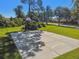 Outdoor community basketball court near the street with trees in a grassy area under a clear, sunny sky at 333 La Creek Ct, Debary, FL 32713