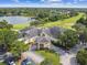 Aerial shot of a clubhouse overlooking a golf course and lake within a residential community at 333 La Creek Ct, Debary, FL 32713