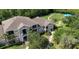 Aerial view of a townhouse complex with a playground and green spaces at 6506 Swissco Dr # 1317, Orlando, FL 32822