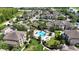 Aerial view of the community with a pool surrounded by lush landscaping at 6506 Swissco Dr # 1317, Orlando, FL 32822