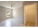 Bright, spacious bedroom with tile floors, ceiling fan, and walk in closet at 6506 Swissco Dr # 1317, Orlando, FL 32822