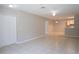 Open-concept living area with tile floors, a ceiling fan, and lots of space at 6506 Swissco Dr # 1317, Orlando, FL 32822