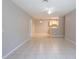 Bright living area with tile flooring, ceiling fan, and a partial view of the kitchen at 6506 Swissco Dr # 1317, Orlando, FL 32822