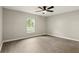 Bright bedroom with wood-look flooring, ceiling fan and a view to the outdoors at 100 Des Pinar Ln, Longwood, FL 32750