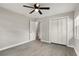 Bedroom with ceiling fan, closet, and access to hallway at 100 Des Pinar Ln, Longwood, FL 32750