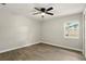 Bedroom with ceiling fan, wood-look floor, and natural light at 100 Des Pinar Ln, Longwood, FL 32750