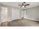 Spacious bedroom with ceiling fan, closet and door to hall at 100 Des Pinar Ln, Longwood, FL 32750