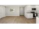 Open floor plan featuring view of modern kitchen with granite countertops and stainless appliances at 100 Des Pinar Ln, Longwood, FL 32750