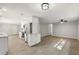 Open-concept living space with wood-look flooring, seamlessly connecting the kitchen and dining area at 100 Des Pinar Ln, Longwood, FL 32750